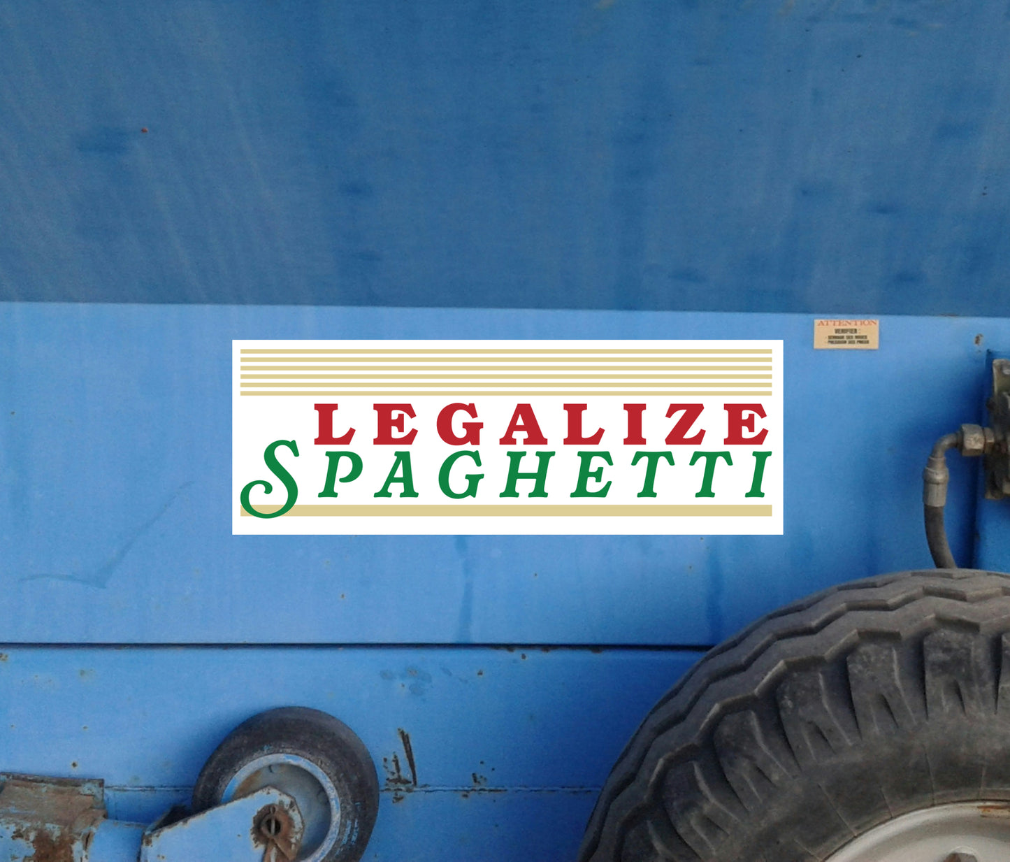 Bumper sticker with 'LEGALIZE SPAGHETTI' text on a van