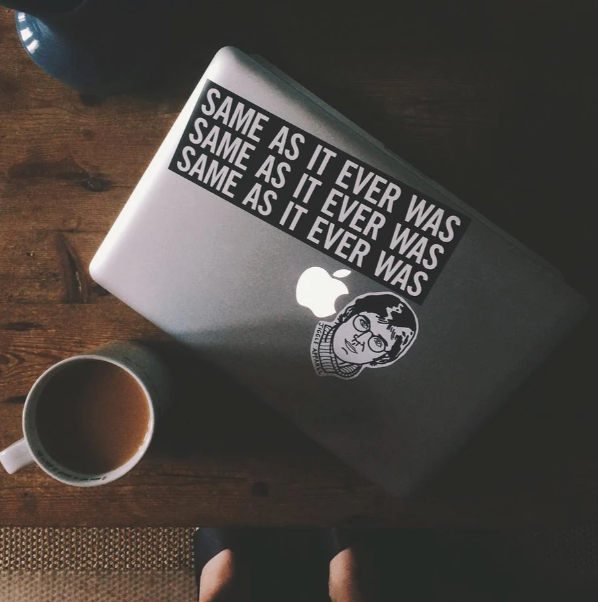 Laptop Stickers - 2 stickers on a apple macbook  next to a cup of coffee